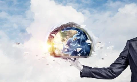 Hand of waitress presenting Earth globe on tray. Stock Photos