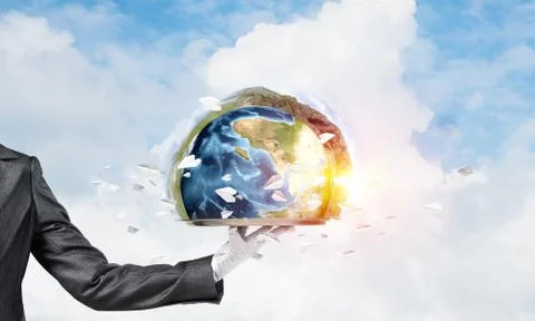 Hand of waitress presenting Earth globe on tray. Stock Photos