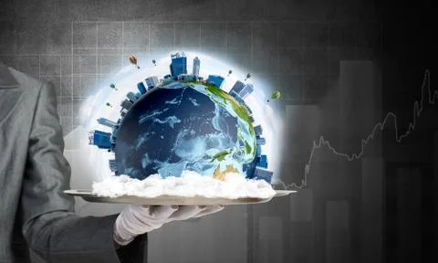 Hand of waitress presenting Earth globe on tray. Stock Photos