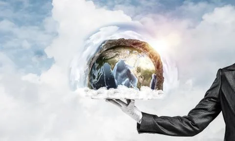 Hand of waitress presenting Earth globe on tray. Stock Photos