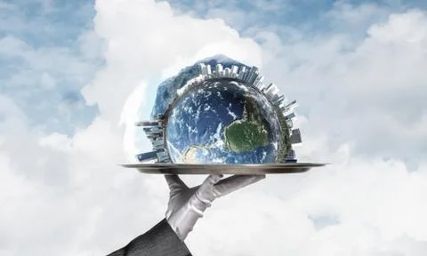 Hand of waitress presenting Earth globe on tray. Stock Photos
