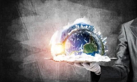 Hand of waitress presenting Earth globe on tray. Stock Photos