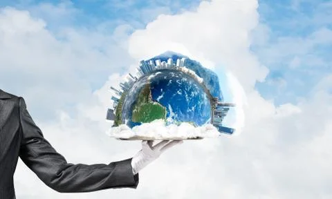 Hand of waitress presenting Earth globe on tray. Stock Photos
