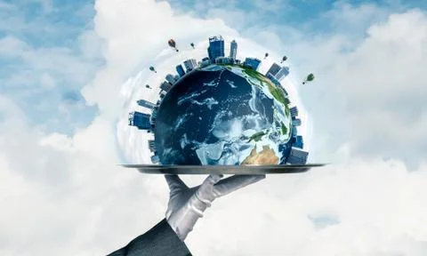 Hand of waitress presenting Earth globe on tray. Stock Photos