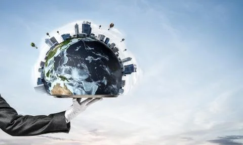 Hand of waitress presenting Earth globe on tray. Stock Photos