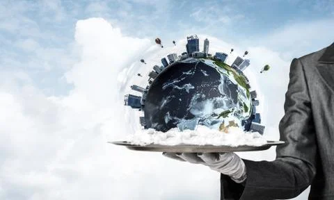 Hand of waitress presenting Earth globe on tray. Stock Photos