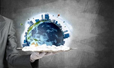 Hand of waitress presenting Earth globe on tray. Stock Photos