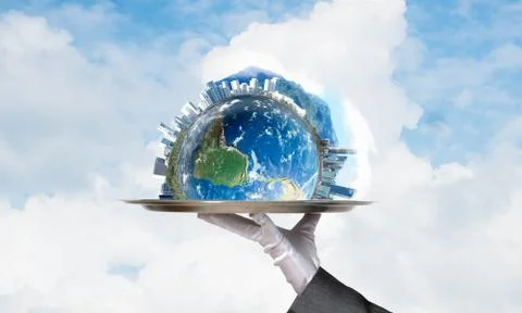 Hand of waitress presenting Earth globe on tray. Stock Photos