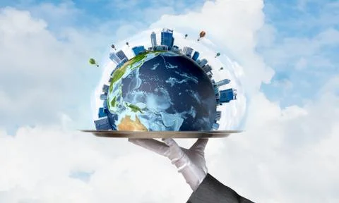 Hand of waitress presenting Earth globe on tray. Stock Photos