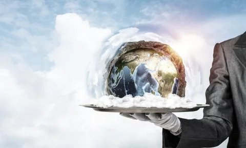 Hand of waitress presenting Earth globe on tray. Stock Photos