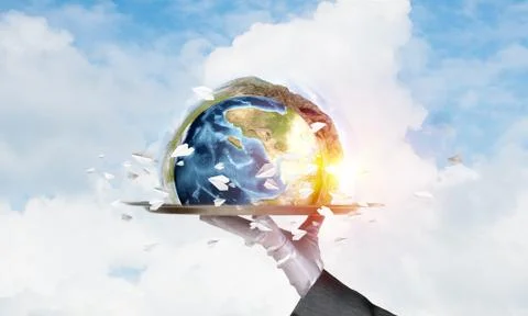Hand of waitress presenting Earth globe on tray. Stock Photos