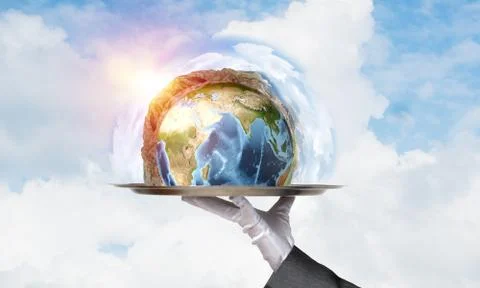 Hand of waitress presenting Earth globe on tray. Stock Photos