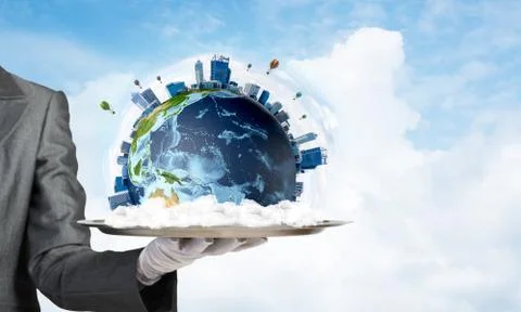 Hand of waitress presenting Earth globe on tray. Stock Photos