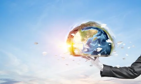 Hand of waitress presenting Earth globe on tray. Stock Photos