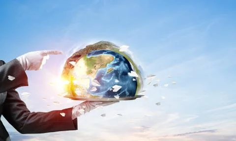 Hand of waitress presenting Earth globe on tray. Stock Photos