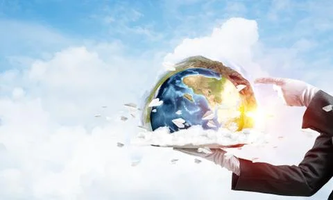 Hand of waitress presenting Earth globe on tray. Stock Photos