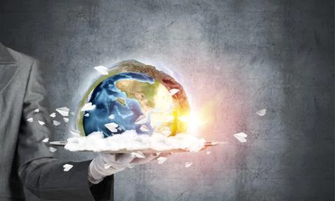 Hand of waitress presenting Earth globe on tray. Stock Photos