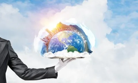 Hand of waitress presenting Earth globe on tray. Stock Photos