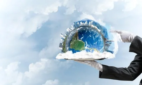 Hand of waitress presenting Earth globe on tray. Stock Photos