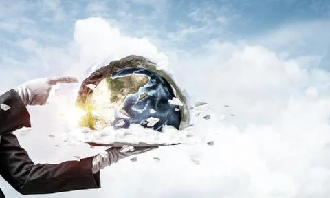 Hand of waitress presenting Earth globe on tray. Stock Photos