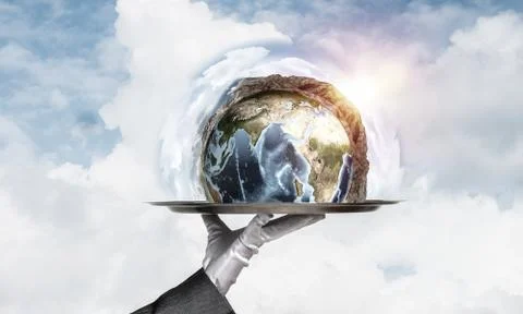 Hand of waitress presenting Earth globe on tray. Stock Photos