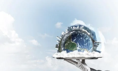 Hand of waitress presenting Earth globe on tray. Stock Photos