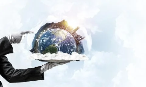 Hand of waitress presenting Earth globe on tray. Stock Photos