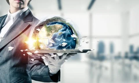 Hand of waitress presenting Earth globe on tray. Stock Photos