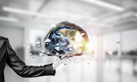 Hand of waitress presenting Earth globe on tray. Stock Photos