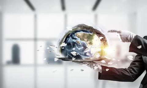 Hand of waitress presenting Earth globe on tray. Stock Photos