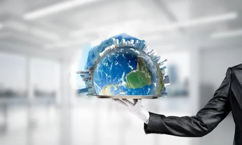 Hand of waitress presenting Earth globe on tray. Stock Photos