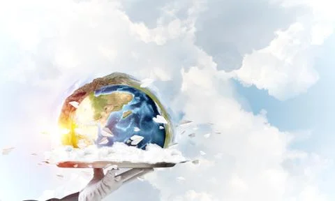Hand of waitress presenting Earth globe on tray. Stock Photos