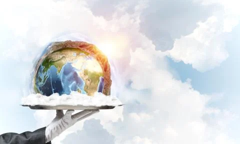 Hand of waitress presenting Earth globe on tray. Stock Photos