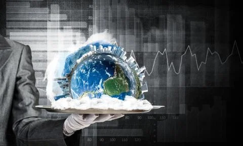 Hand of waitress presenting Earth globe on tray. Stock Photos