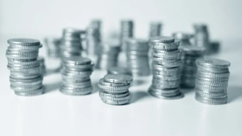 Hand walking between stacks of cents Stock Footage 127128386