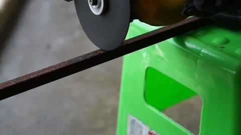 The hand was cutting iron using a grinder machine Stock Footage 127805323