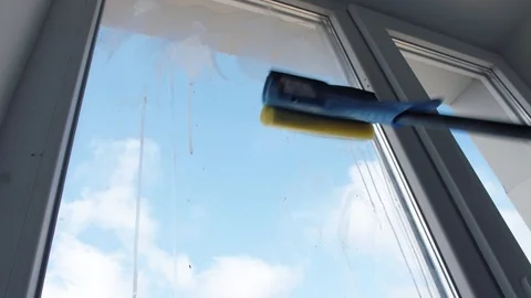 Hand washes the window with a brush Stock Footage 127248049