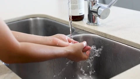 Hand Washing Routine at Kitchen Sink 库存影片 311696809