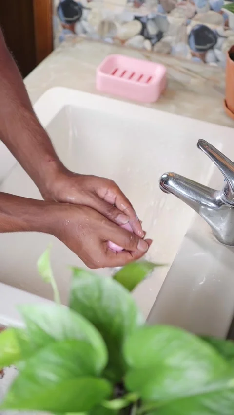 Hand washing steps at a kitchen sink for cleanliness Stock Footage 337875662