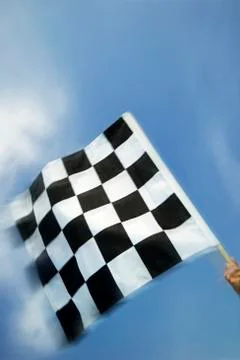 Hand waving checkered flag Fotos Stock