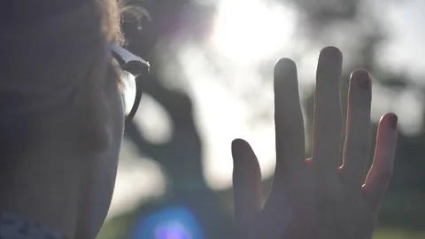 Hand Waving In The Sun Stock Footage 77334847