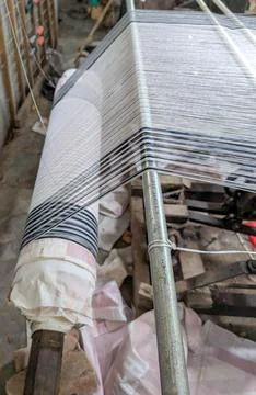 Hand weaving process in a workshop with a focus on the loom and threads in .. Stock Photos