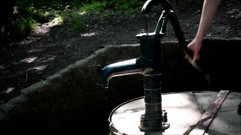 Hand well pipe in forest sunny summer day outside no water dry Stock Footage 134567089