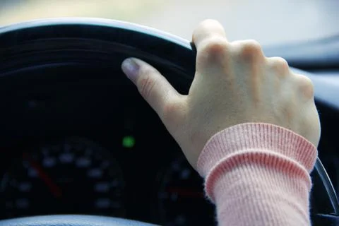 Hand on wheel Stock Photos