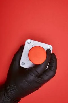 The hand which constrict the emergency button Stock Photos