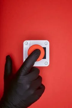 The hand which pushes the emergency button Stock Photos