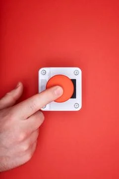 The hand, which pushes the emergency button Stock Photos