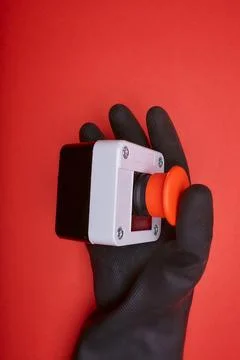 The hand which pushes the emergency button Stock Photos