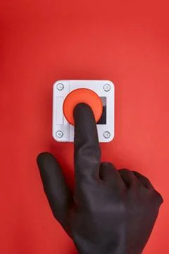 The hand which pushes the emergency button Stock Photos