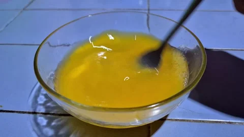 Hand whisking eggs in a bowl Stock Footage 337726071
